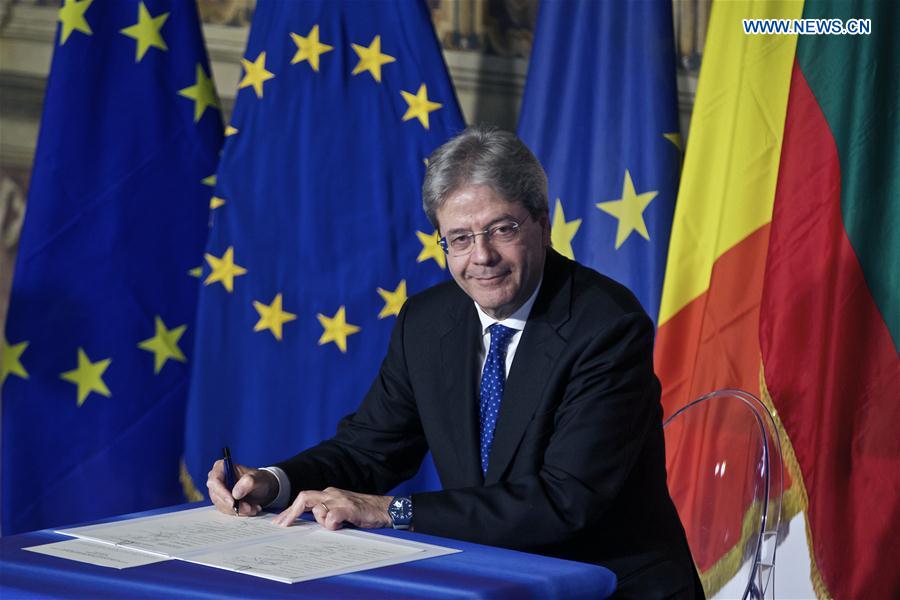 Italian Prime Minister Paolo Gentiloni signs the 'Declaration of Rome' during a ceremony at Capitoline Hill in Rome, Italy, on March 25, 2017. 