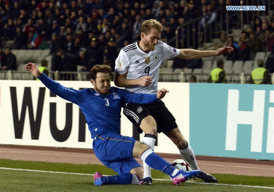 Andre Schurle (R) of Germany vies with Rahid Amirguliyev of Azerbaijan during the FIFA World Cup 2018 European Qualifiers Group C match between Azerbaijan and Germany in Baku, Azerbaijan, March 26, 2017. 