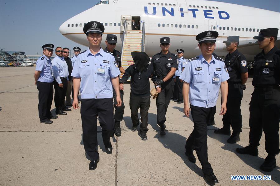 CHINA-BEIJING-UNITED STATES-WANTED SUSPECTS-HANDING OVER (CN)