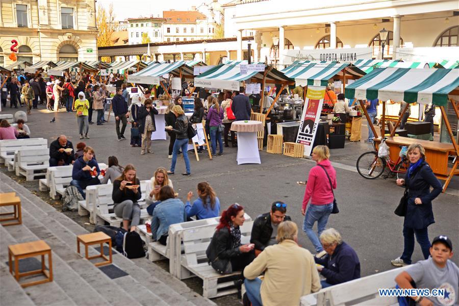 People Enjoy Delights Of Freshly Cooked Food At Open Kitchen In