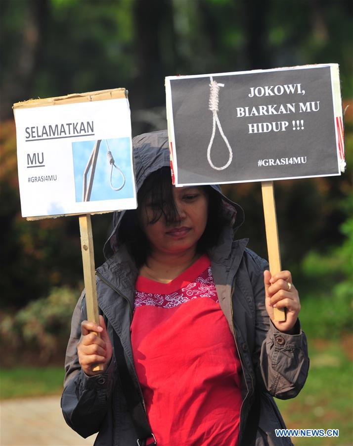 Protestors hold placards against death penalty in Jakarta, Indonesia, on July 26, 2016. 