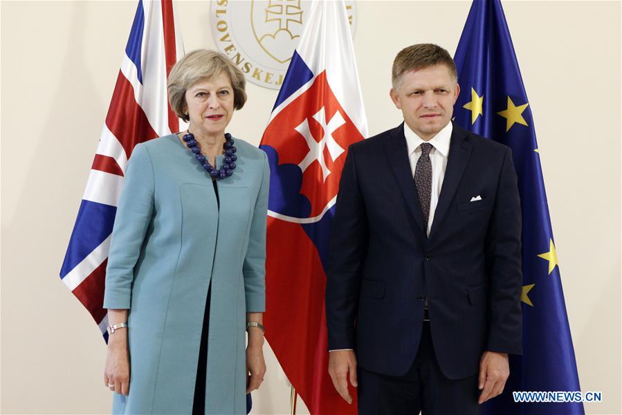 Slovak Prime Minister Robert Fico (R) and his British counterpart Theresa May pose for photography during a joint press conference in Bratislava, Slovakia, on July 28, 2016. 
