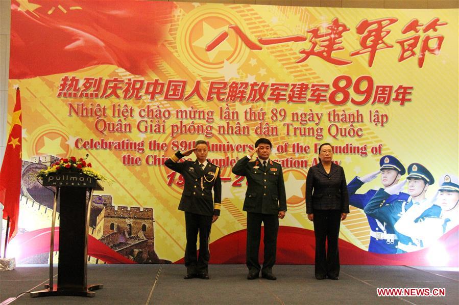 Chinese Charge d'affaires ad interim to Vietnam Xi Hui (R), Deputy Chief of the General Staff of the Vietnam People's Army Vo Van Tuan (C) and military attache of the Chinese Embassy in Vietnam Luo Bin attend a reception celebrating the 89th anniversary of the founding of the Chinese People's Liberation Army (PLA), at the Chinese Embassy in Hanoi, Vietnam, July 28, 2016. 