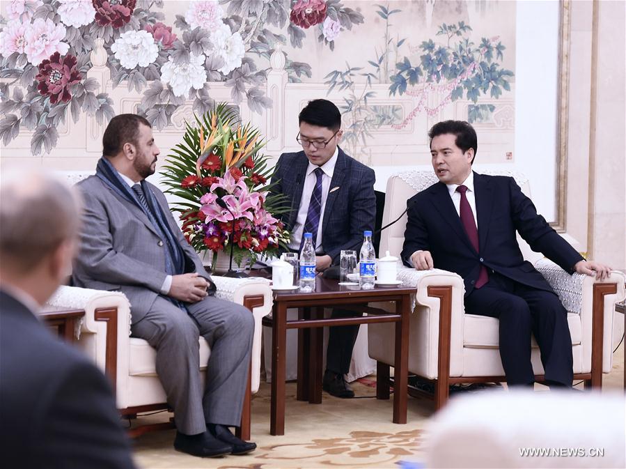 Wang Zhengwei (R), vice chairman of the National Committee of Chinese People's Political Consultative Conference (CPPCC), meets with the delegation of Oman-China friendship association in Beijing, capital of China, Dec. 13, 2016. (Xinhua/Yan Yan) 