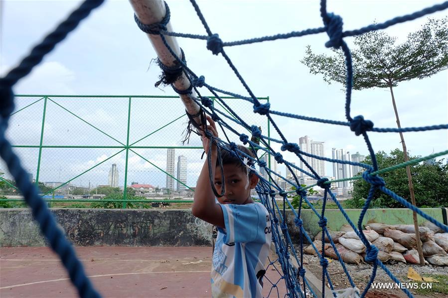 Children sit on a wall at a playground in Petamburan, Jakarta, Indonesia, Jan. 12, 2017. (Xinhua/Agung Kuncahya B.)