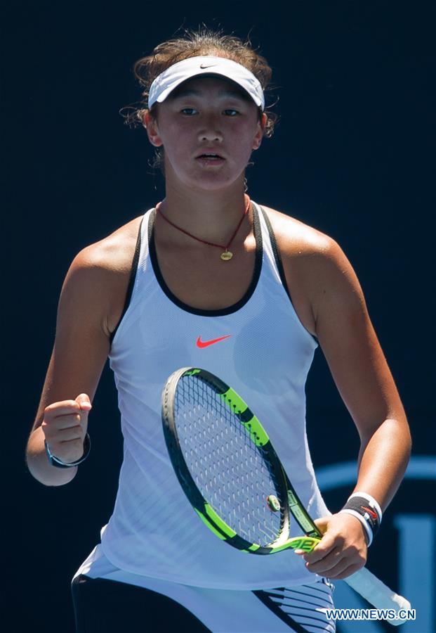 Wang Xiyu of China reacts during the junior girls' singles first round match against Maja Chwalinska of Poland at the Australian Open Tennis Championships in Melbourne, Australia, Jan. 22, 2017. Wang won 2-1. (Xinhua/Bai Xue) 