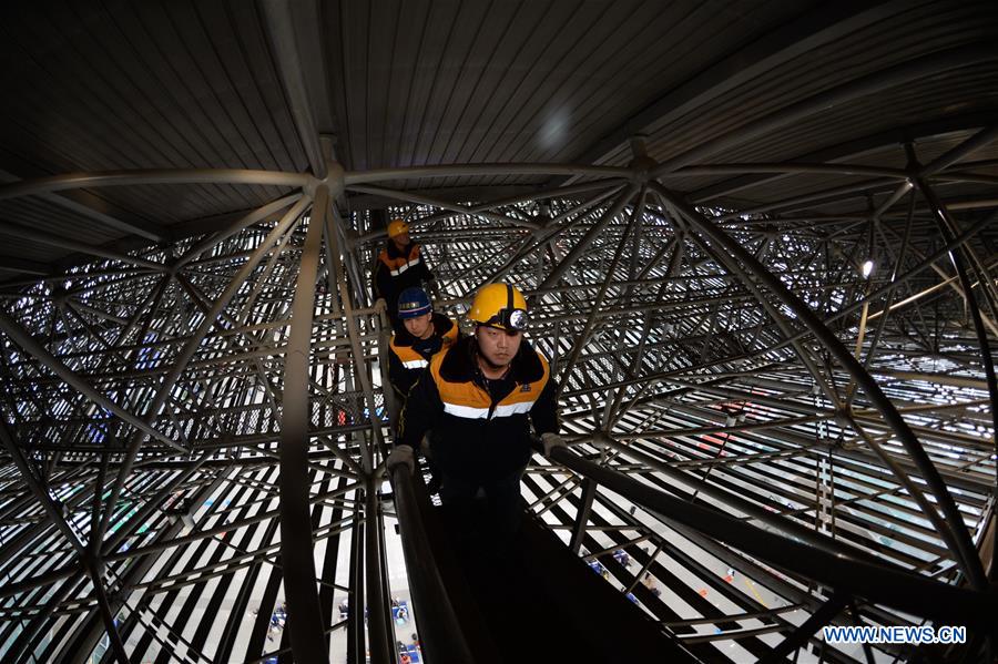 Maintenance workers patrol at Xi'an North Railway Station in Xi'an, northwest China's Shaanxi Province, Jan. 21, 2017. Local railway department carries out a routine check on electrical system every week to ensure the illumination of the railway station. (Xinhua/Li Yibo) 