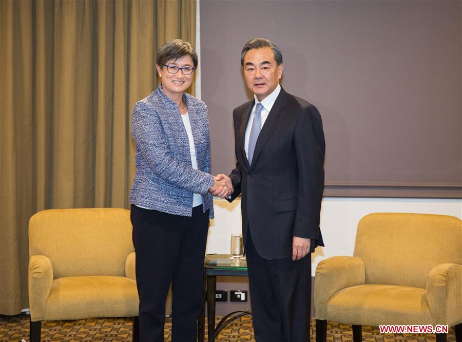 Chinese Foreign Minister Wang Yi (R) shakes hands with Penny Wong, acting leader of the opposition Australian Labor Party (ALP) in the Senate, during their meeting in Canberra, Australia, Feb. 7, 2017. (Xinhua/Zhu Hongye)
