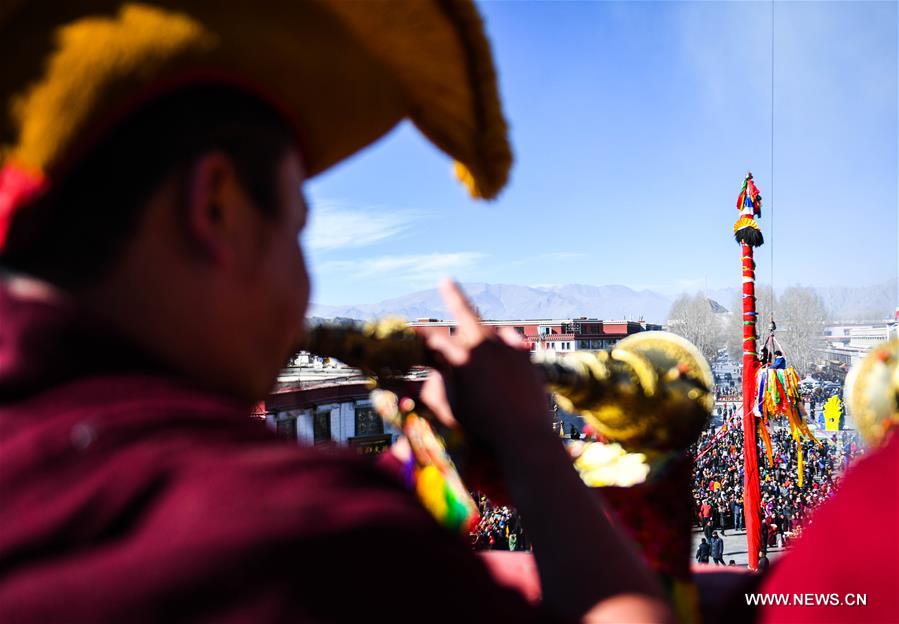 As the Tibetan New Year draws near, prayer flags tied on the five poles surrounding the Jokhang Temple have been replaced by new ones in accordance with Tibetan tradition. 