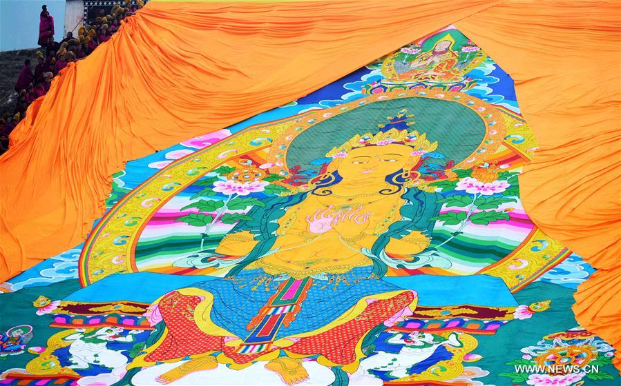 The annual display of Buddha thangka, a Tibetan Buddhist scroll painting, in Labrang Monastery is a Tibetan Buddhism traditional praying for a good year.