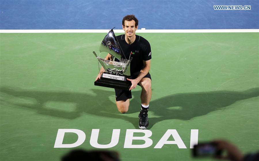 Andy Murray of Britain poses with the trophy after winning the men's singles final match against Fernando Verdasco of Spain at the Dubai Duty Free Tennis ATP Championships in Dubai, the United Arab Emirates, March 4, 2017.