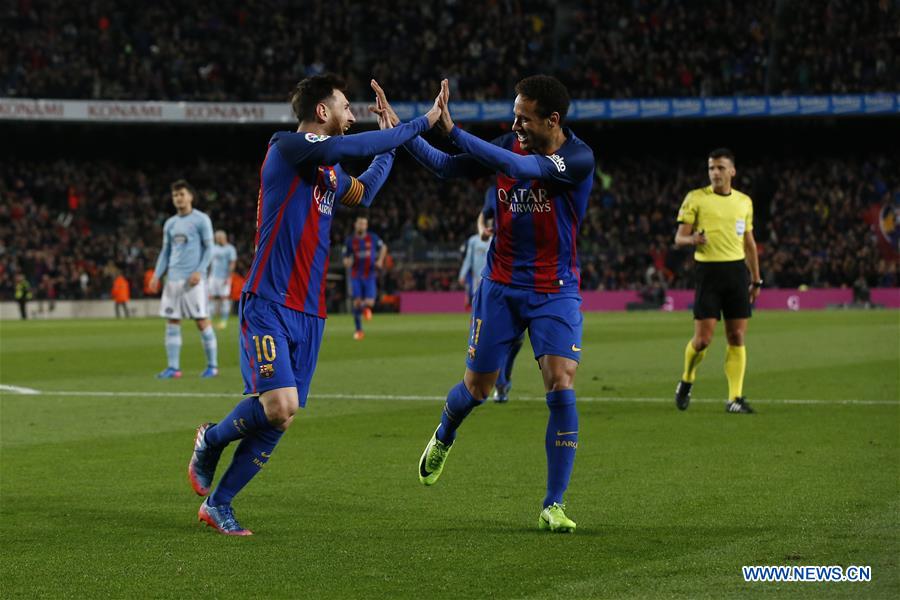 Barcelona's Lionel Messi (L) celebrates with Neymar after scoring during the Spanish first division soccer match between FC Barcelona and Celta de Vigo at the Camp Nou Stadium in Barcelona, Spain, March 4, 2017. Barcelona won 5-0.