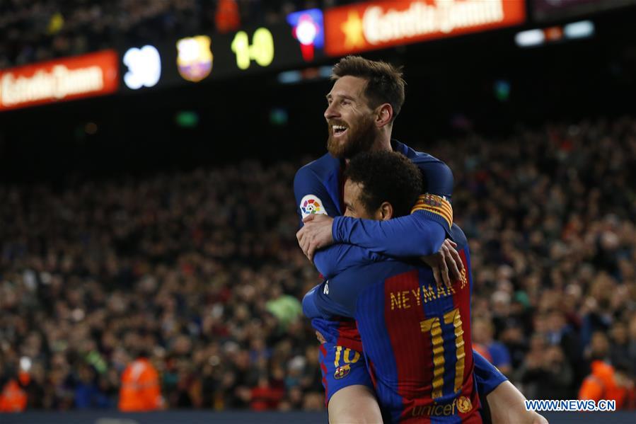 Barcelona's Lionel Messi (Up) celebrates with Neymar after scoring during the Spanish first division soccer match between FC Barcelona and Celta de Vigo at the Camp Nou Stadium in Barcelona, Spain, March 4, 2017. Barcelona won 5-0. 