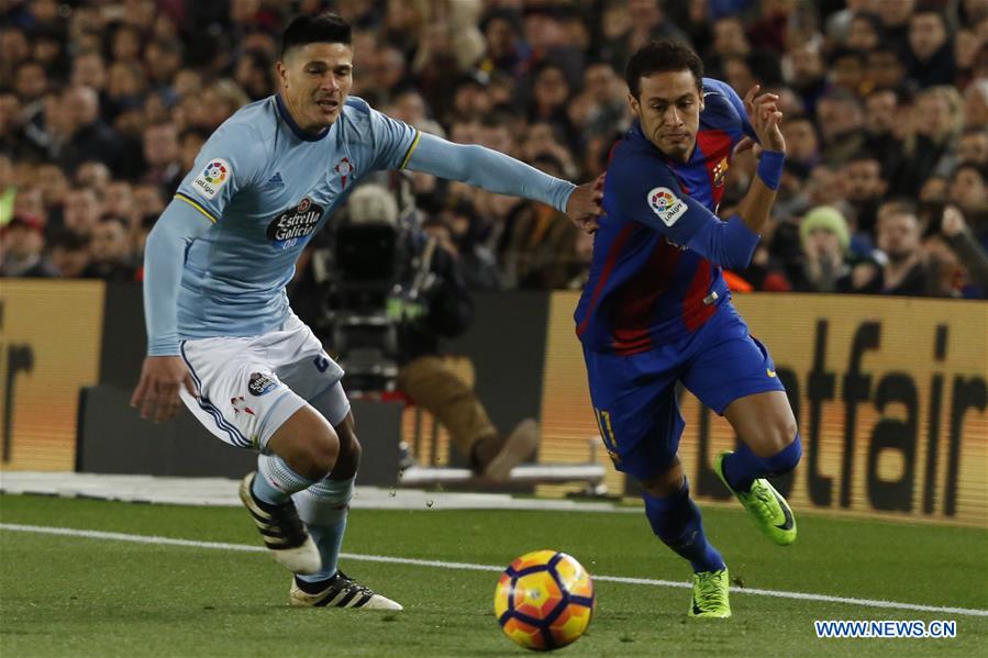 Barcelona's Neymar (R) competes during the Spanish first division soccer match between FC Barcelona and Celta de Vigo at the Camp Nou Stadium in Barcelona, Spain, March 4, 2017. Barcelona won 5-0.