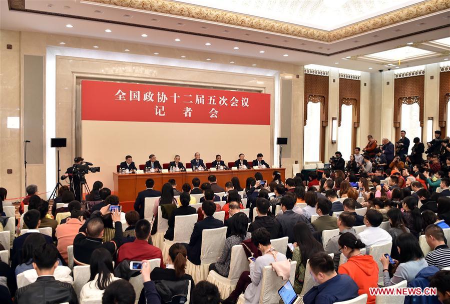 Li Yining, Chen Xiwen, Yang Kaisheng, Chang Zhenming and Qian Yingyi, members of the 12th National Committee of the Chinese People's Political Consultative Conference (CPPCC), attend a press conference for the fifth session of the 12th CPPCC National Committee on promoting stable and healthy economic growth at the Great Hall of the People in Beijing, capital of China, March 6, 2017.