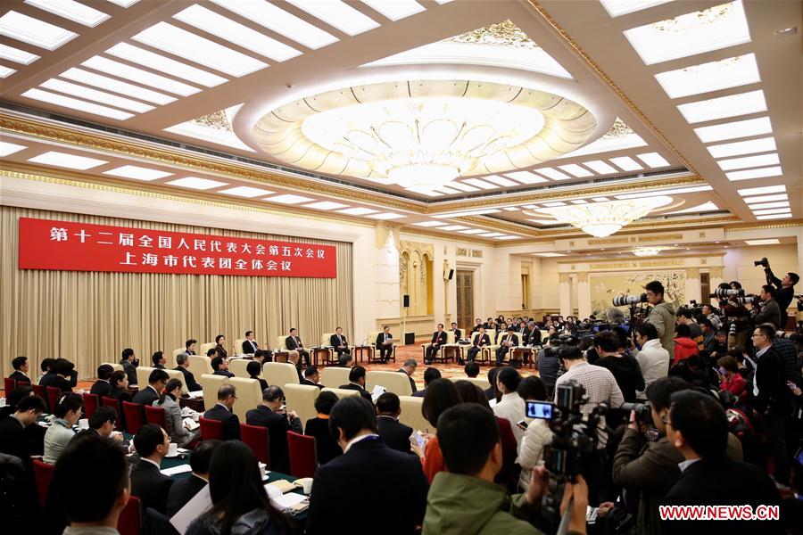 Photo taken on March 6, 2017 shows the scene of a plenary meeting of the 12th National People's Congress (NPC) deputies from Shanghai Municipality during the annual NPC session in Beijing, capital of China. The meeting was opened to media. (Xinhua/Jin Liwang) 