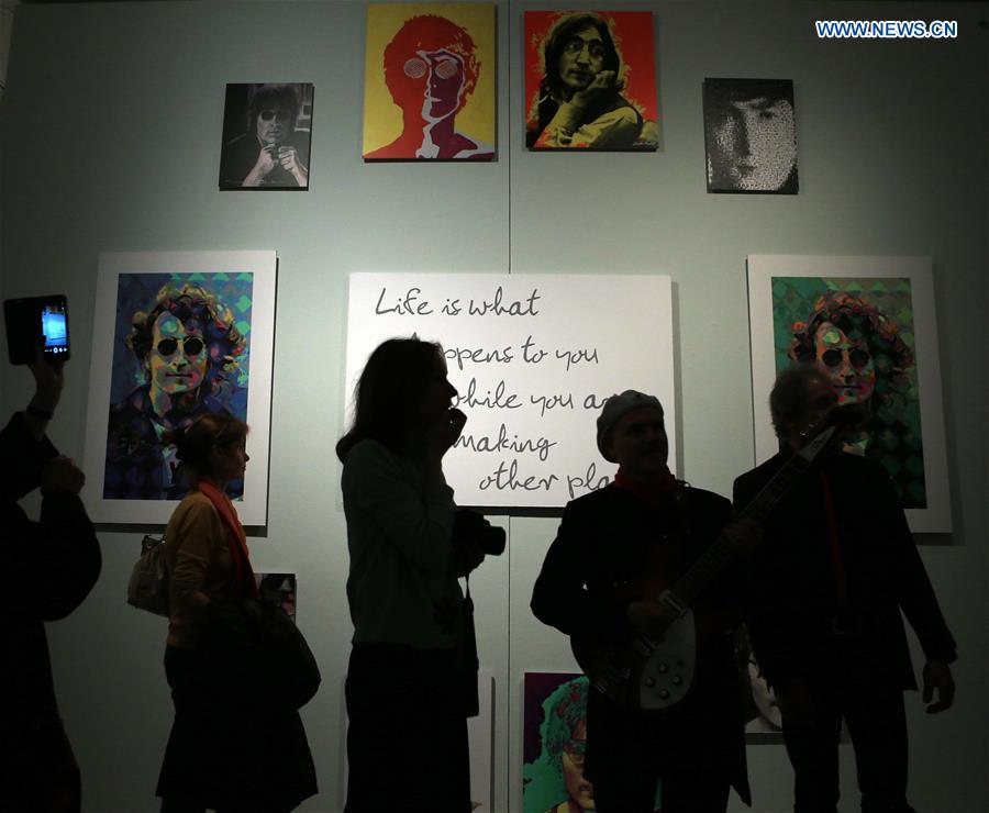 People visit the exhibition 'Imagine John Lennon' at the Kurpfaelzische Museum in Heidelberg, Germany, on March 15, 2017.
