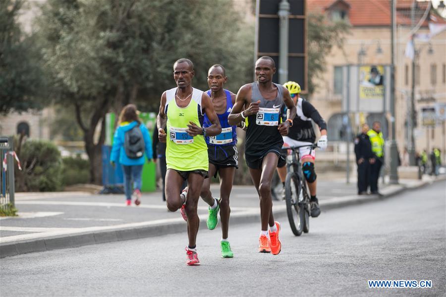 Runners take part in the 7th International Jerusalem Winner Marathon in Jerusalem, on March 17, 2017. (Xinhua/Guo Yu)