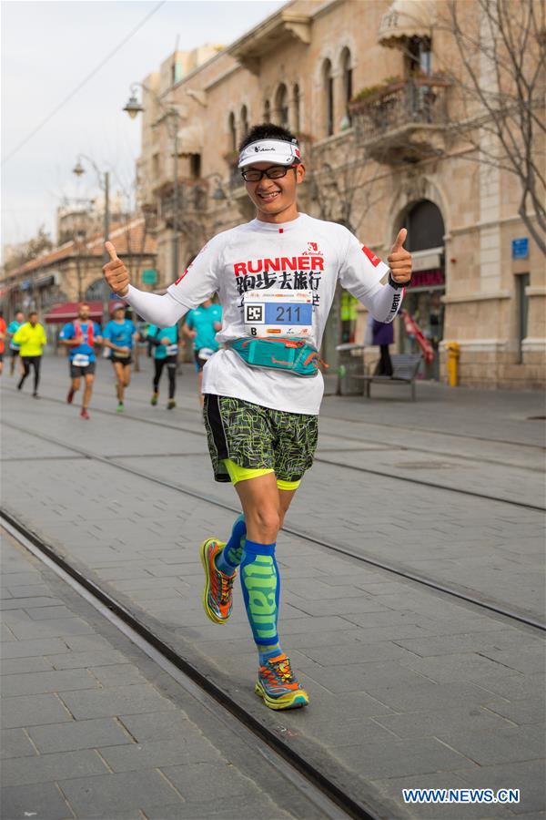 A Chinese runner takes part in the 7th International Jerusalem Winner Marathon in Jerusalem, on March 17, 2017. (Xinhua/Guo Yu)