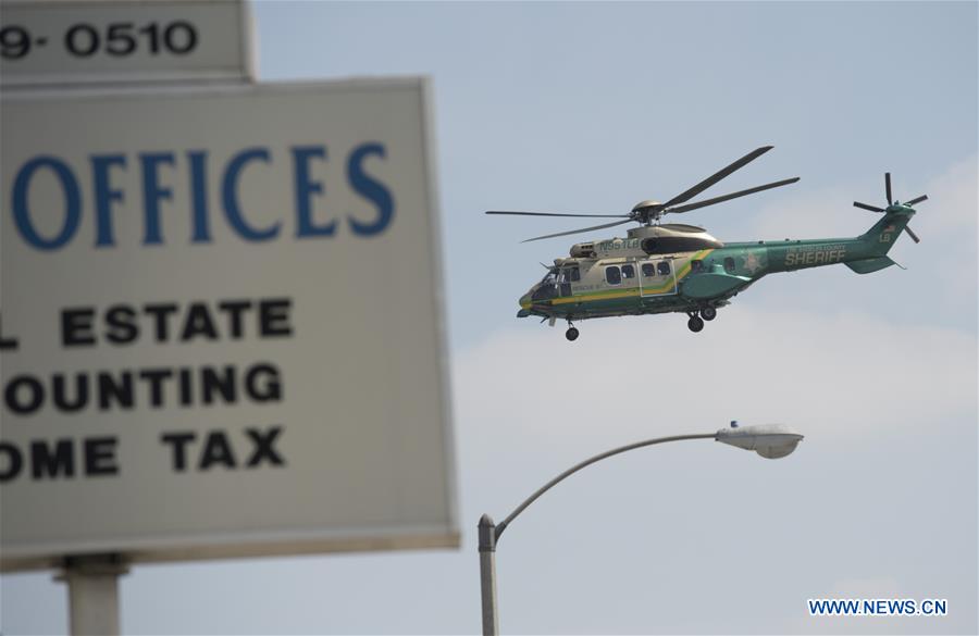 A helicopter is seen near the site of a shootout outside a Los Angeles County sheriff's station, the United States, on March 20, 2017. An armed man died in a shootout outside a Los Angeles County sheriff's station early Monday morning, according to local authorities. (Xinhua/Yang Lei) 