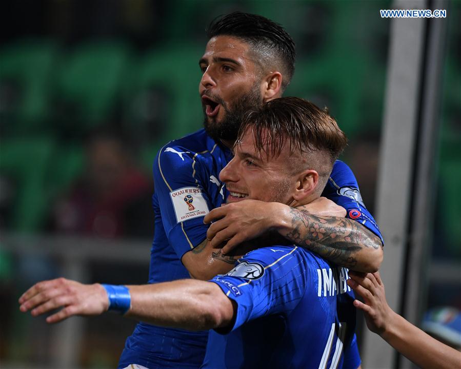 Ciro Immobile(R) of Italy celebrates after scoring the second goal during the FIFA 2018 World Cup Qualifying soccer match between Italy and Albania in Palermo, Italy, on March 24, 2017.