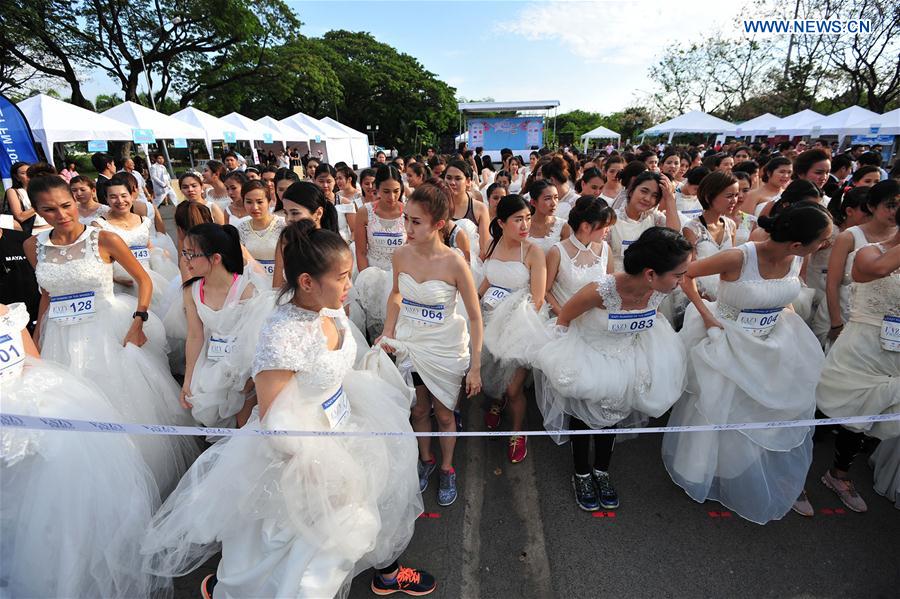 Brides-to-be gather at the start-line to attend the 'EAZY Running of the Brides' contest in Bangkok, Thailand, March 25, 2017.
