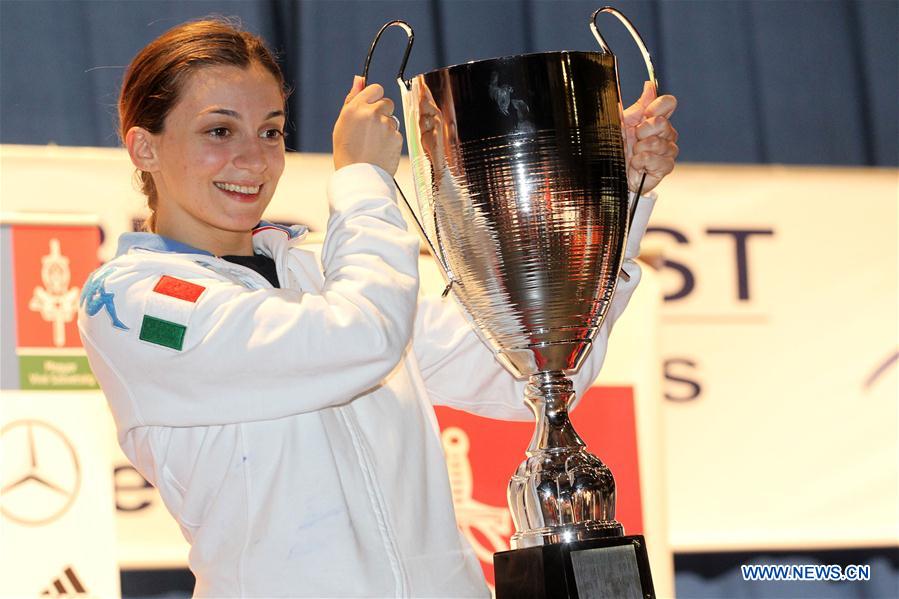 Gold medalist Rosella Fiamingo of Italy poses with trophy during the awarding ceremony of the Women's Epee Grand Prix in Budapest, Hungary, March 26, 2017. (Xinhua/Csaba Domotor) 