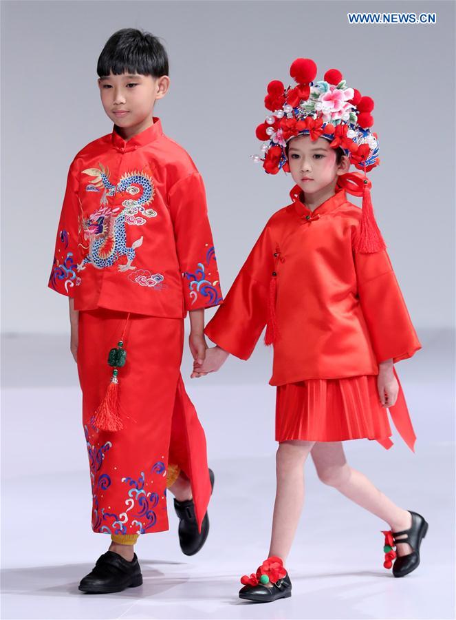 Young models walk the runway at the Wangxiaohe children's collection show by Fan Yong during China Fashion Week in Beijing, capital of China, March 26, 2017. 