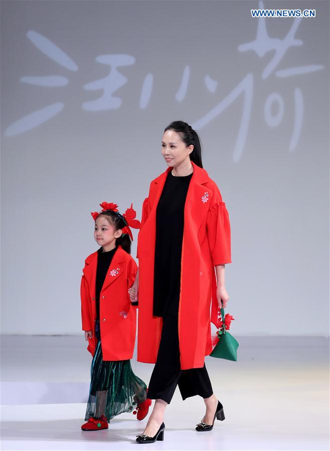 Models walk the runway at the Wangxiaohe children's collection show by Fan Yong during China Fashion Week in Beijing, capital of China, March 26, 2017.
