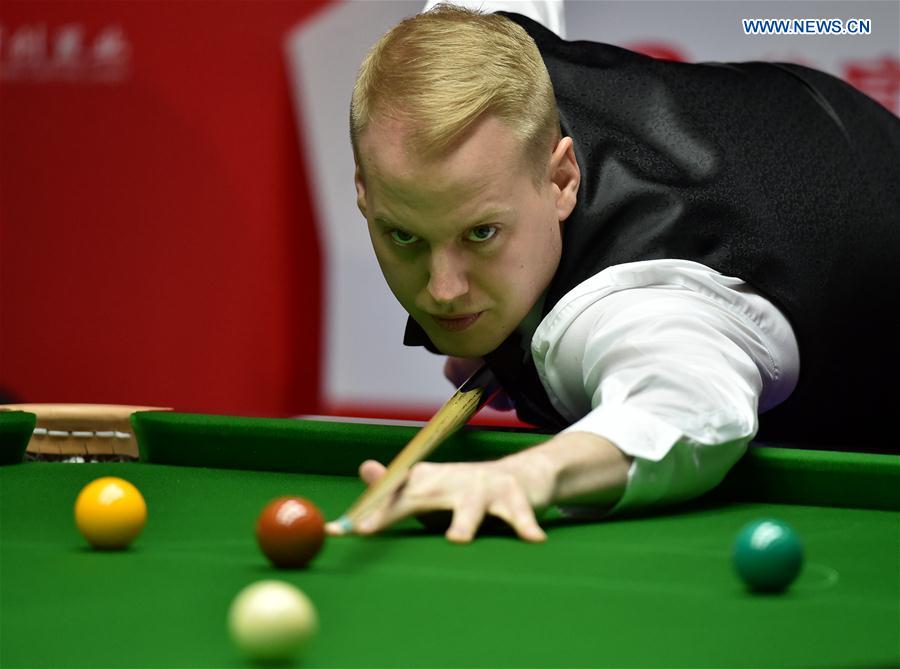 Allen Taylor of England competes during the first round of 2017 World Snooker China Open Tournament against his compatriot Shaun Murphy, in Beijing, capital of China, March 27, 2017. 