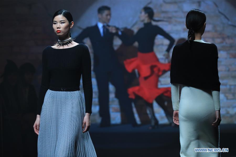 A model presents a creation designed by Carey Xu during China Fashion Week in Beijing, capital of China, March 29, 2017. (Xinhua/Li Mingfang) 