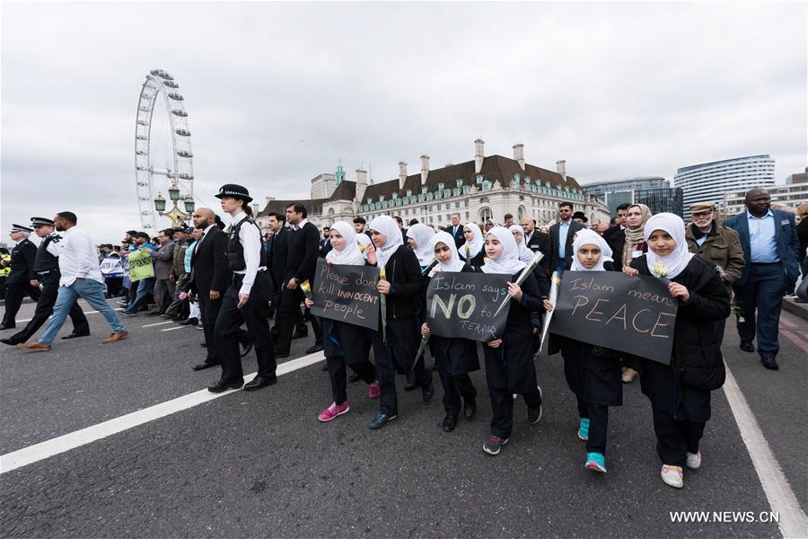 Members of muslim community attend an event on Westminster Bridge to commemorate the victims of last week's terror attacks in London, Britain on March 29, 2017.