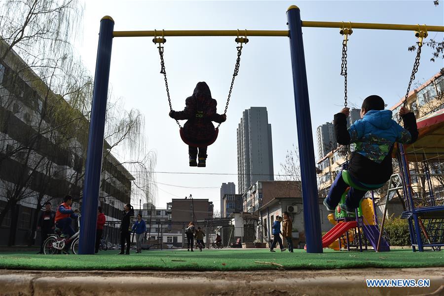 Children play swings at a service center of the Lingxing community in Taiyuan, capital of north China's Shanxi Province, March 28, 2017. Established in 2010, the service center has accommodated over 60 children with autism. A total of 29 teachers take part in the rehabilitation program to help these children. April 2 marks the World Autism Awareness Day. (Xinhua/Zhan Yan) 