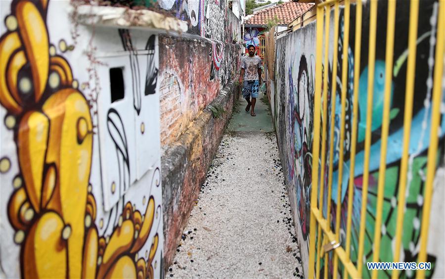 A man walks at the Batman's Alley in Sao Paulo, Brazil, on March 29, 2017. Batman's Alley is a popular tourist destination because of the dense concentration of graffiti that line the streets. (Xinhua/Li Ming) 