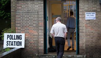Polling stations open for EU referendum in Britain