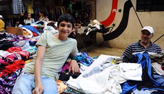 Syrians buy second-hand clothes in Damascus