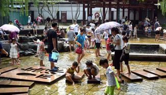 People cool themselves across China as temperature rises