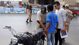 Pakistani rangers check people due to high security alert