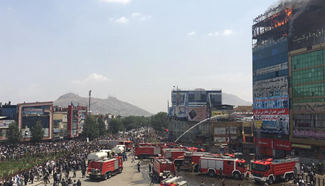 Fire devours business center in Kabul