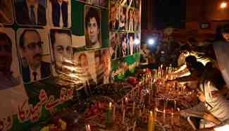 Pakistani civil society activists hold vigil for victims of suicide bombing