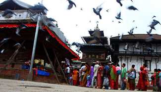 Nepalese Hindu devotees offer prayers to Lord Shiva in front of Kageshwor temple