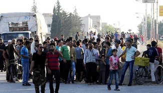 Several rebels in rural Damascus surrender to Syrian gov't