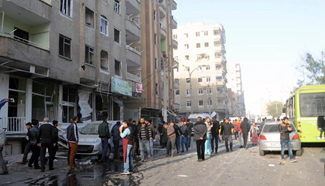 People gather around blast site in city center of Diyarbakir, Turkey