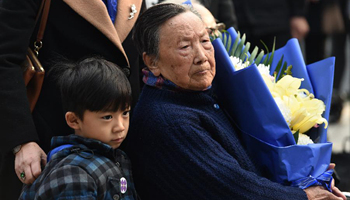 People mourn family members in Nanjing Massacre