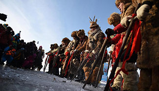 People perform ice-collection folk arts on Songhuajiang River, NE China