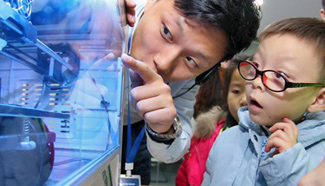 Children fascinated by 3D printing