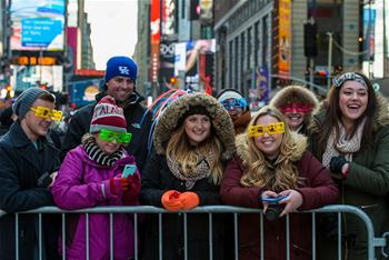 People wait to attend New Year celebration at Times Square in NYC