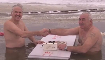 Latvia: playing chess during winter swimming competition