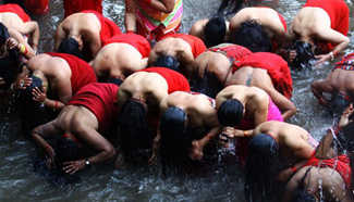 Hindu devotees take holy bath on 1st day of Madhav Narayan Festival