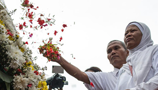 People mark victims of last year's terrorist attack in Jakarta, Indonesia